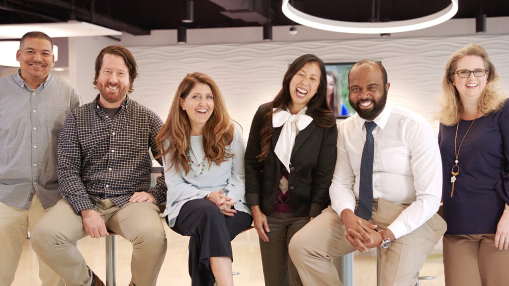 associates laughing in employee lounge